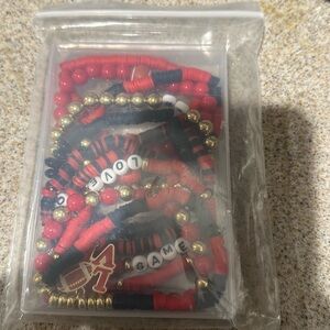 6/$25 red and black football bracelets